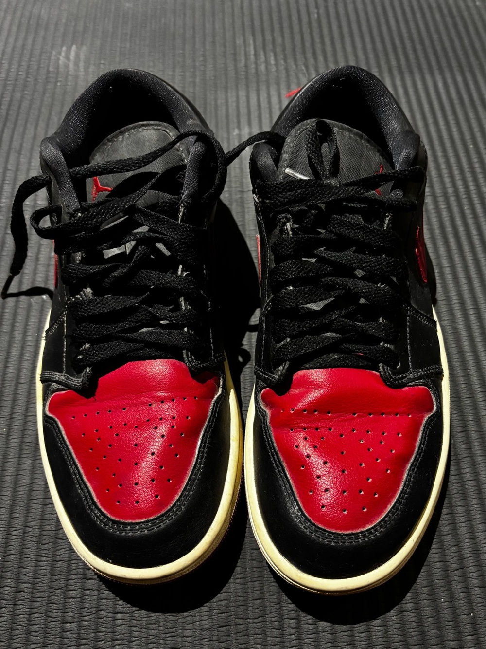 Air Jordan 1 Black and Red Low-Top Athletic Sneakers